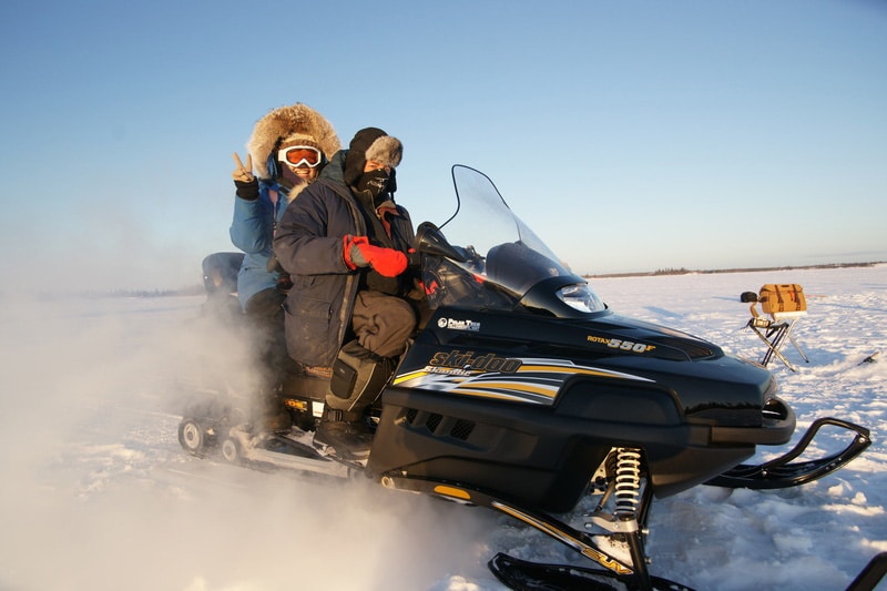 https://www.discovercanadatours.com/wp-content/uploads/2022/05/@NWTTourism-CTC-Yellowknife-Snowmobiling.jpg