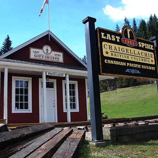 https://www.discovercanadatours.com/wp-content/uploads/2022/05/Last-Spike-at-Craigellachie-e1657646557689.jpeg