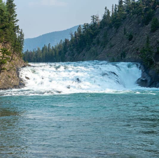 https://www.discovercanadatours.com/wp-content/uploads/2022/05/©Lisanne_Smeele_BowFalls4-scaled-e1657146142375.jpg
