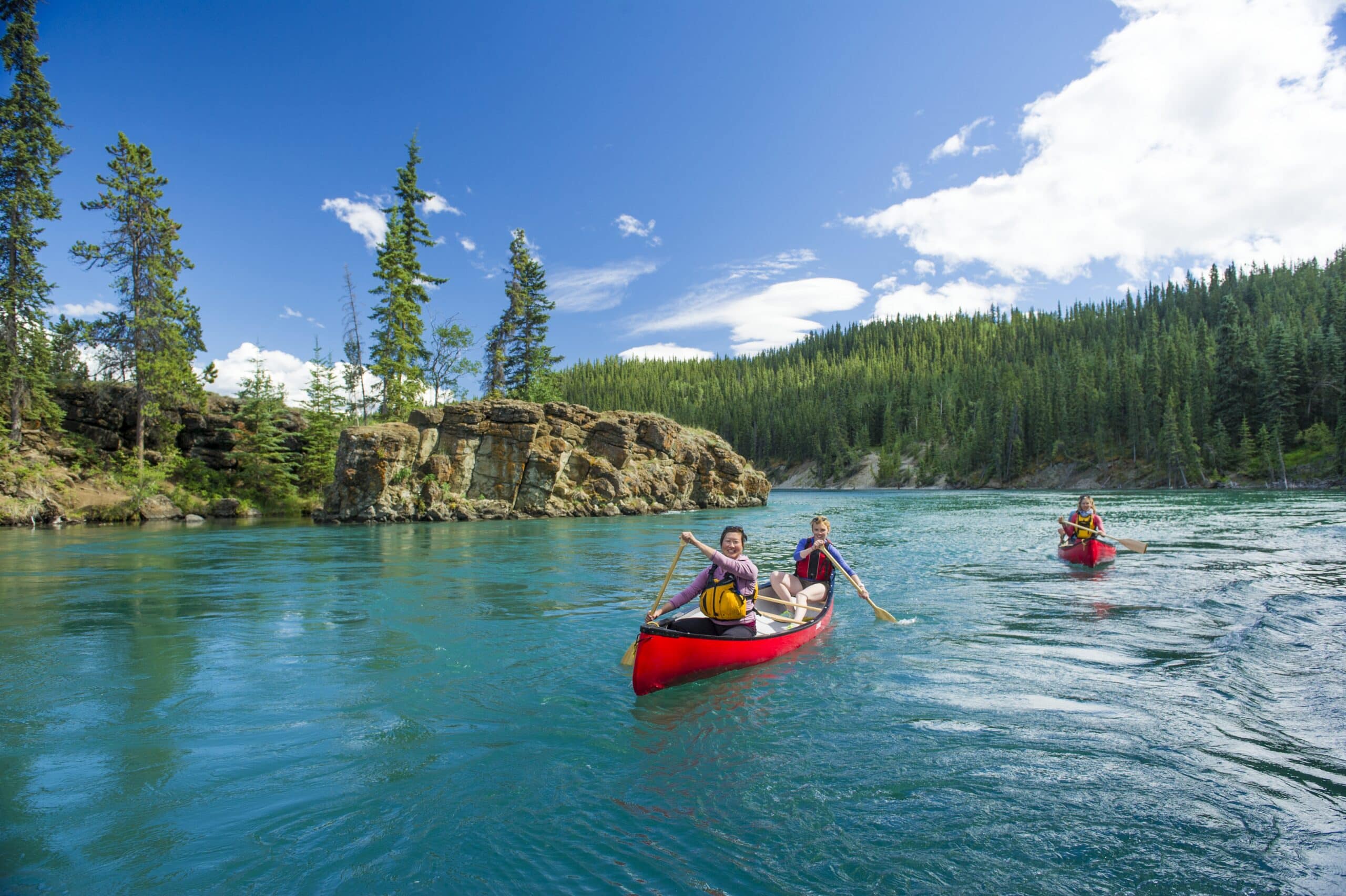 https://www.discovercanadatours.com/wp-content/uploads/2023/01/canoeingMilescanyon-39535-scaled.jpg