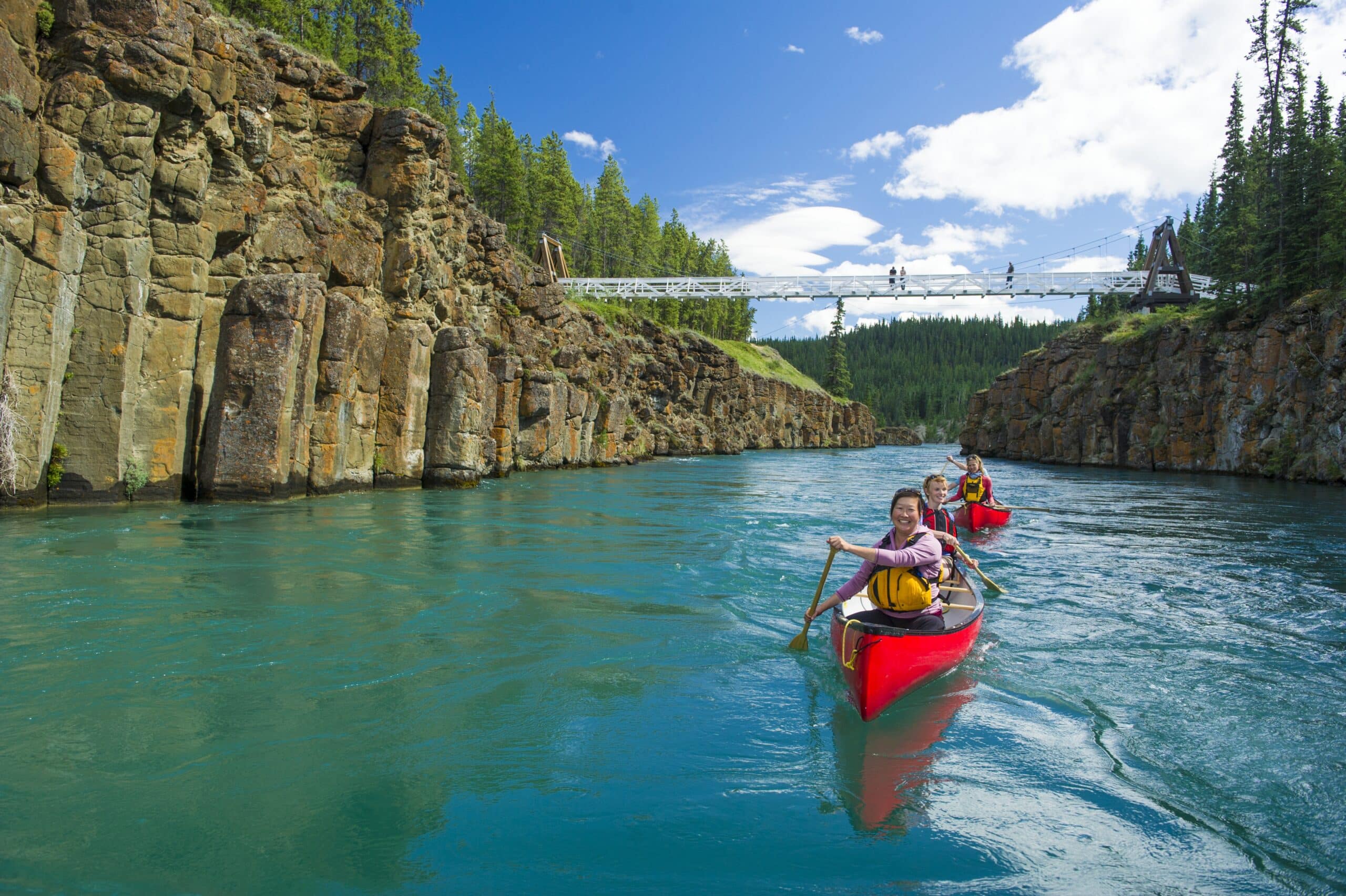 https://www.discovercanadatours.com/wp-content/uploads/2023/03/canoeingMilescanyon-39554-scaled.jpg