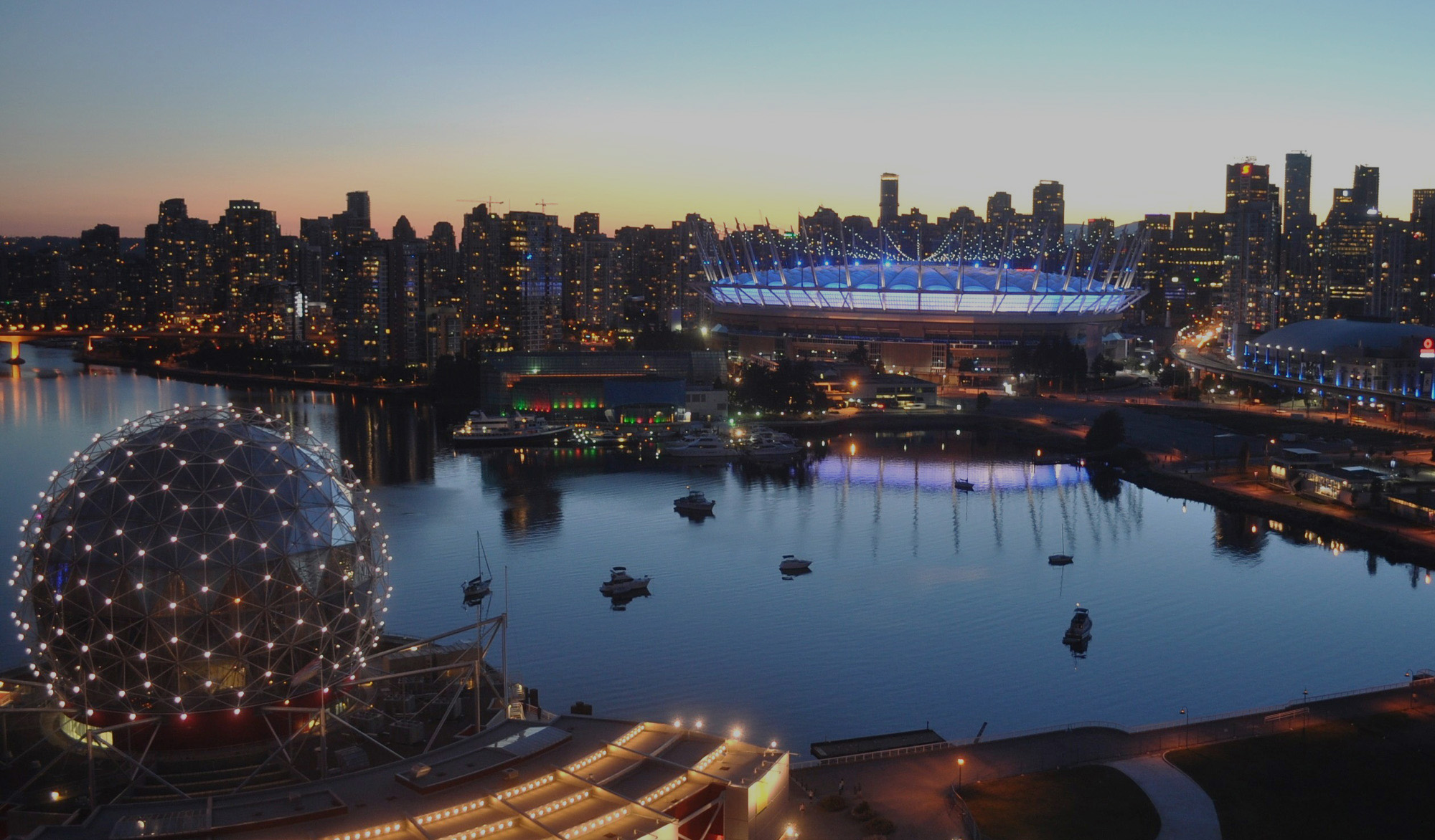 https://www.discovercanadatours.com/wp-content/uploads/2026/01/©DestinationVancouver-BC-Place-BCPlace-2000x1172-dark.jpg